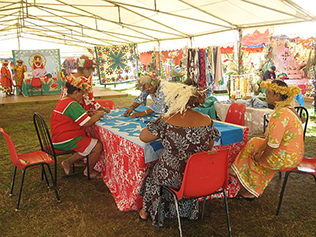 Tahitian matrons working on bedspreads